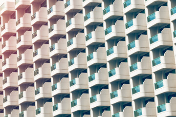 Obraz premium Facade of a skyscraper with open balconies. Background, texture