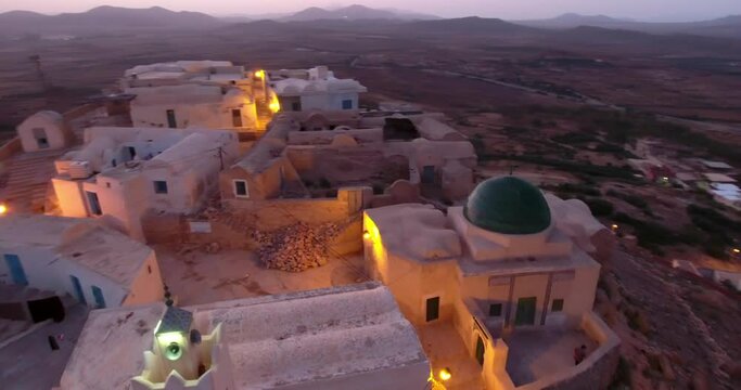 Aerial Panning Beautiful View Of Mosque On Hill Top During Sunset - Djerba, Tunisia