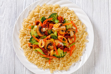 quinoa with fried veggies, mushrooms on plate