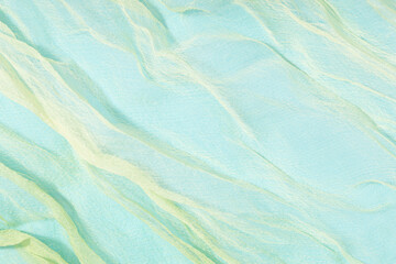 Blue and Green Abstract background texture of soft chiffon. Full frame