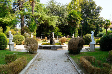a beautiful quiet green park in the Italian town Portogruaro ( a town and comune in the...