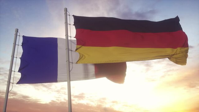 France and Germany flag on flagpole. France and Germany waving flag in wind. France and Germany diplomatic concept