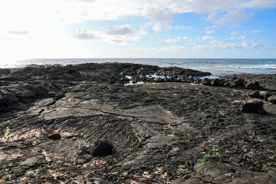 Solidified lava on the sandy O'oma Beach near Kailua-Kona in the west of Big Island in Hawaii, United States - Favorite getaway location among locals