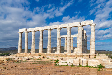 Fototapeta premium Temple of Poseidon with blue sky and clouds, Sounion, Greece