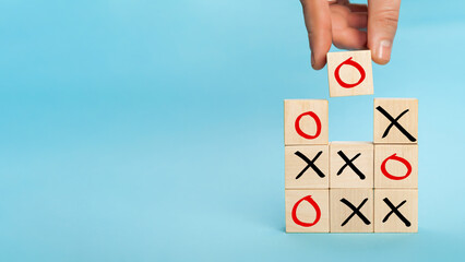 Wooden block tic tac toe board game. Business marketing strategy