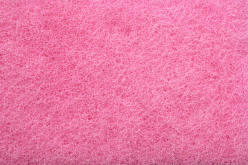 pink fiber polishing pads textured background, Texture of a abrasive scourer dishwashing sponge. Background of a scrub cleaning sponge close up.                          