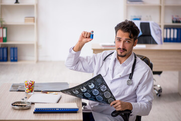 Young male doctor radiologist working in the clinic