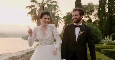 Young married couple dancing after wedding ceremony in Isola Del Garda