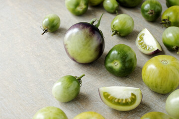 Green tomatoes unripe edible vegetable for zero waste cooking. Heirloom tomatoes from own garden.