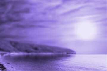 Fototapeta na wymiar Violet purple evening over. Sea mount Impressive sunset over the lake.