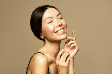 Beauty and spa. Overjoyed asian young woman portrait. Skin care and treatment concept.