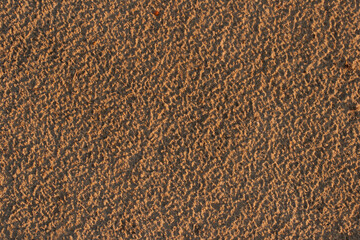Sandy surface. The texture of the seashore after the rain.
