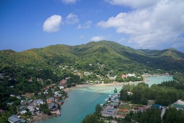 Drone field of view of turquoise blue water and harbour in Praslin, Seychelles.