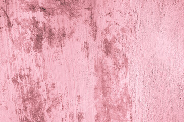 Background, texture of a painted concrete dirty in spots, a cracked wall in a light red color with a tint.