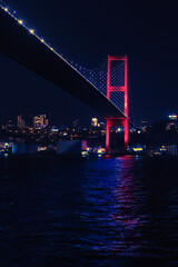 Fototapeta na wymiar Bosphorus Bridge, bridge at night, reflection of light on the sea