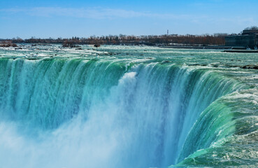 Fototapeta na wymiar Close view of Niagara Falls waters falling down
