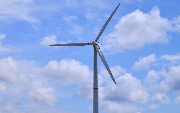 wind turbines generating electricity in power station green energy renewable with blue sky background