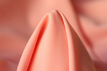 Pale pink fabric in the form of cone