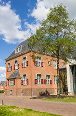 Fototapeta na wymiar Tree in front of the historic town hall of Veendam, Netherlands