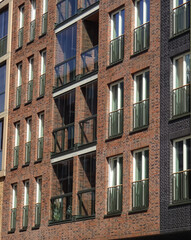 Close up of new modern building brick facade with brown blocks in Noblessner district. Tallinn, Estonia, Europe. April 2022