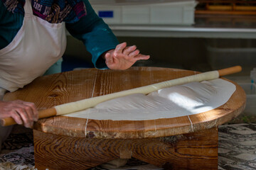 A woman making pancakes in Antalya, Turkey. SELECTİVE FOCUS