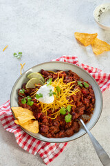Chili con carne - traditional mexican minced meat and vegetables stew in tomato sauce