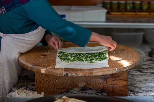 A woman making pancakes in Antalya, Turkey. SELECTİVE FOCUS