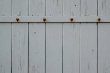 Foto op Plexiglas wooden door with rusty nails © Mitzy