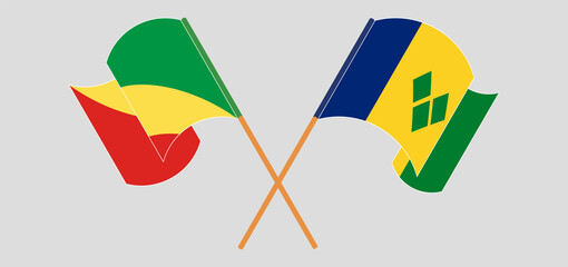 Crossed and waving flags of Republic of the Congo and Saint Vincent and the Grenadines