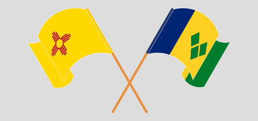 Naklejka premium Crossed and waving flags of the State of New Mexico and Saint Vincent and the Grenadines