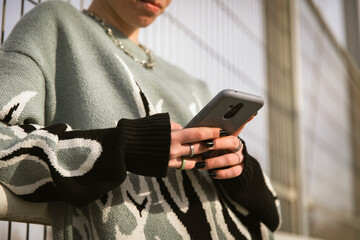 Close-up of a girl texting on her smartphone