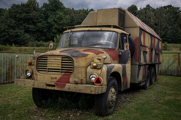 Old, military, armored truck transporter