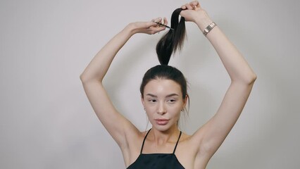 Girl with scissors in a hairdressing salon