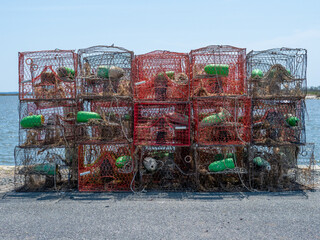 Crabpots stacked outside on a dock waiting to be used by commercial fisherman