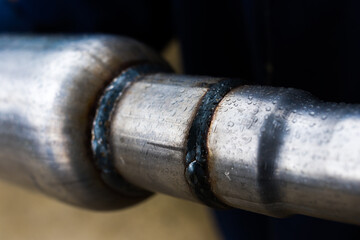 welding seam of a muffler for a car, close up