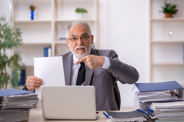 Old male employee and too much work in the office