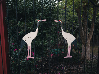 Gate with crane bird