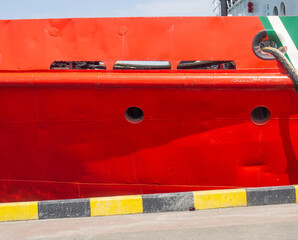 Moored ship. Portholes in the hold. Ship at the pier. Equipment in the port