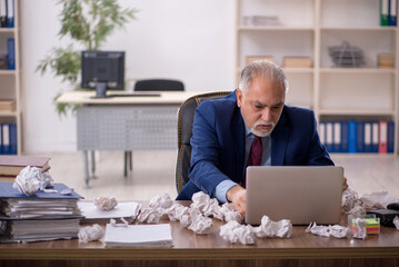Old male employee in brainstorming concept