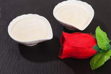 Collagen powder on black background.