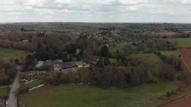 Aerial view rising over the village of Middle Barton in Oxfordshire. 