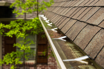 Gutter on home overlfowing with water
