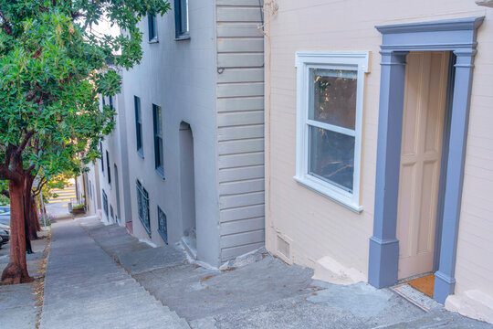 Steep Sloped Concrete Side Walk With Steps In The Middle In San Francisco, California