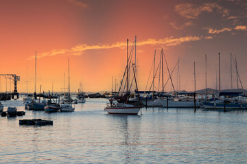 Fototapeta na wymiar Sunset with sailboats anchored at the edge of the Ribeira in Salvador Bahia Brazil