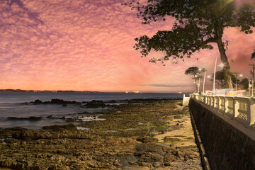 Fototapeta na wymiar Sunset on the edge of Barra beach in Salvador Bahia Brazil