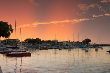 Sunset with sailboats anchored at the edge of the Ribeira in Salvador Bahia Brazil