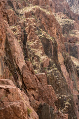 Fototapeta na wymiar Sun Highlights The Cliffs Above The River Trail In Grand Canyon
