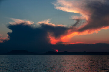 a beautiful sunset with clouds on Lake Balaton