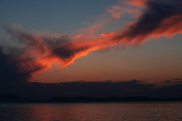 Red and blue sky before sunrise on the lake