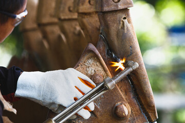 Cutting a steel with a gas torch.  Gas welding and oxy-fuel cutting are processes that use fuel...